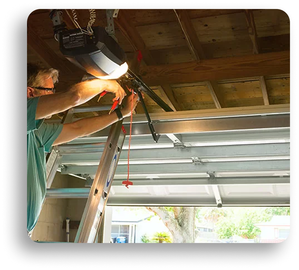 A person standing on a ladder repairs a garage door opener inside a garage with the door partially open and sunlight coming through, while American Patriot Roofing completes a roofing repair nearby.